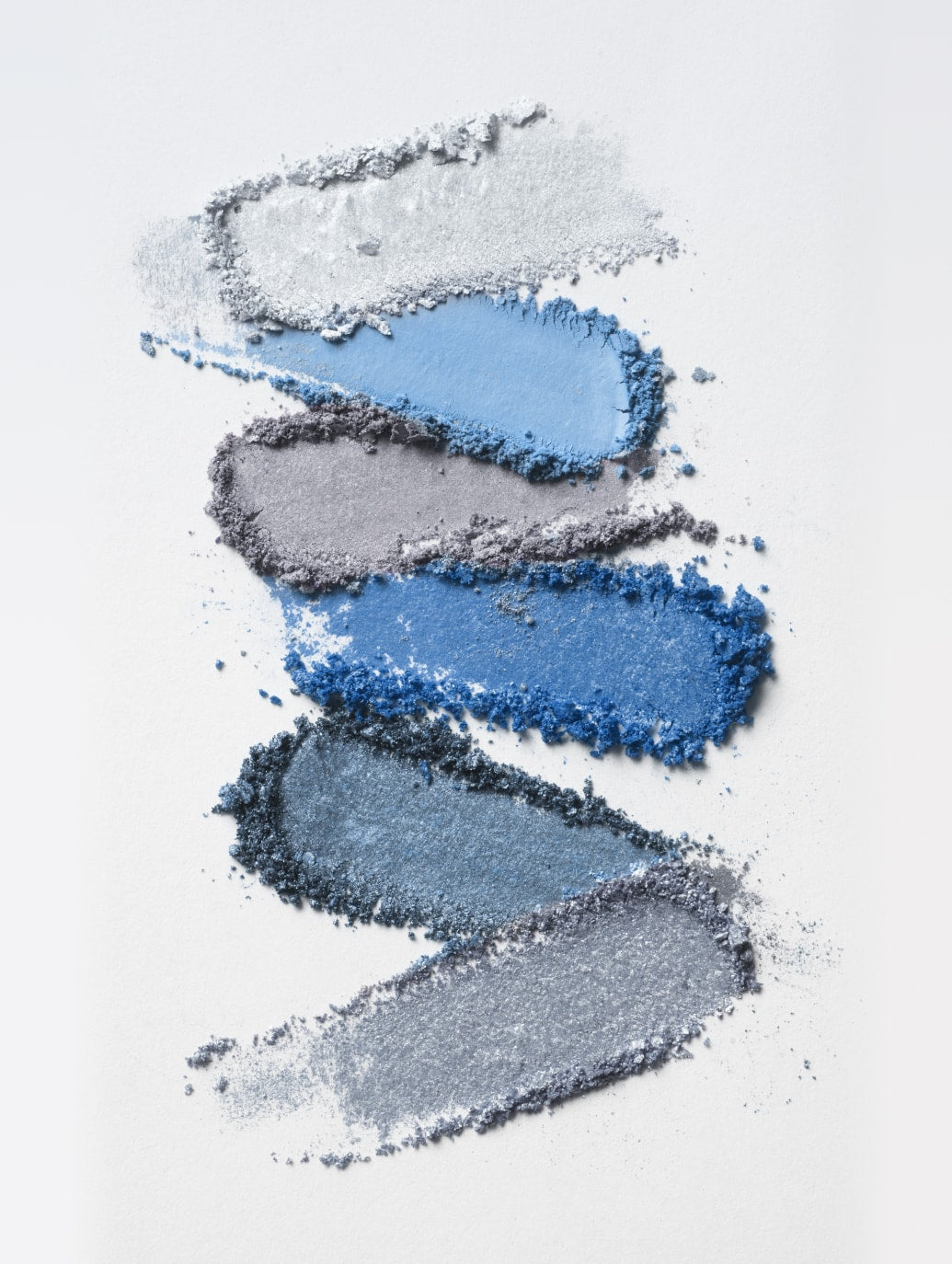 shades of pigment scattered on a white background
